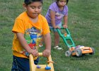 KidsMowers copy  Yahir Leal, 4, front left, and his sister Lesly Leal, 2, back right, use toy mowers as they pretend to mow the yard at their home in Spartanburg Monday evening, 5-14-07.